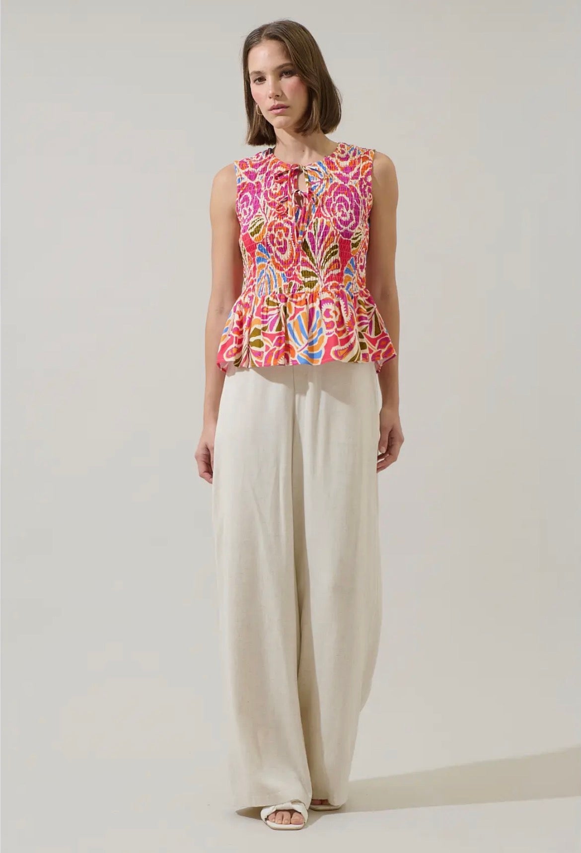 Nomi Floral Tinda Smocked Peplum Top